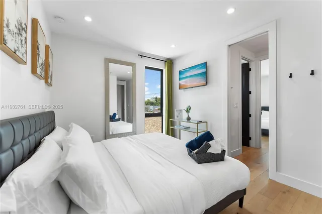 a bedroom with a bed and hallway