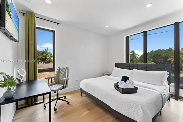 a bedroom with a bed and a chair