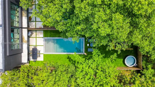 a view of a chairs and backyard with a slide