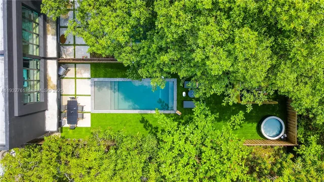 a view of a chairs and backyard with a slide