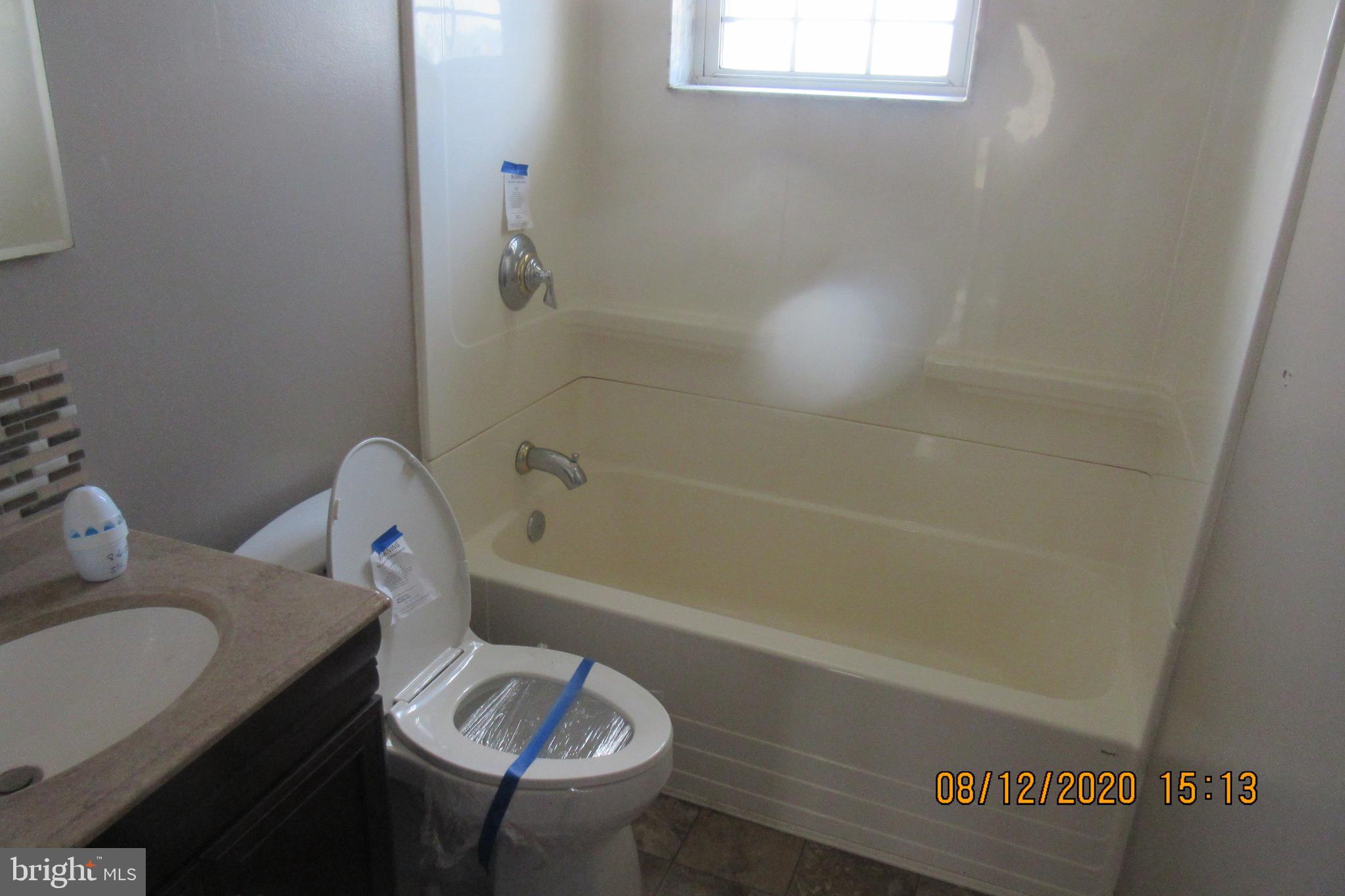 4449 Scotia Road Baltimore, MD 21227 - Photo 11 of 16 Hallway Bathroom