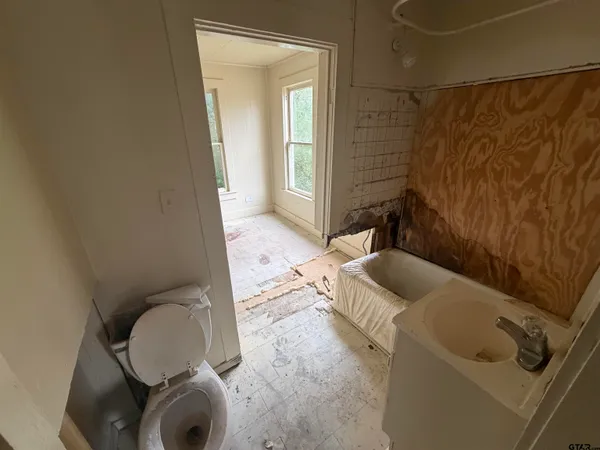 a bathroom with a sink and toilet