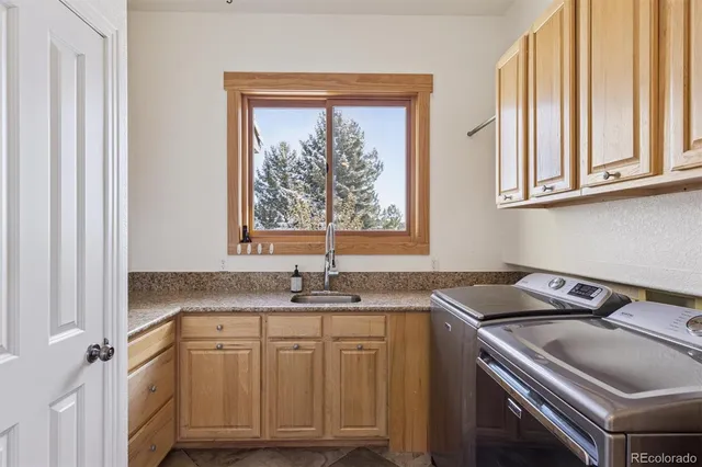 a bathroom with a sink and a window