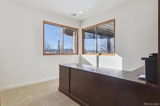 a view of a room with a large window