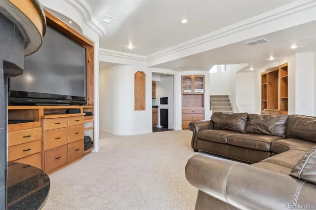 a view of livingroom with furniture and stairs