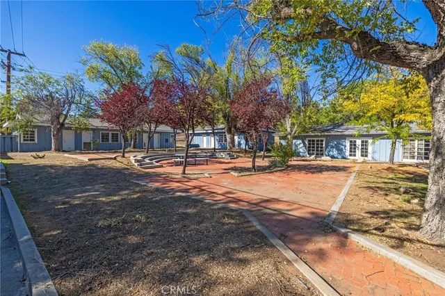 a view of a yard with trees