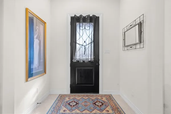 a view of a hallway with front door