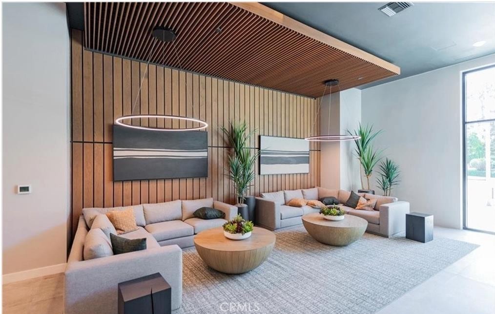 3608 Rivington Irvine, CA 92612 - Photo 42 of 74 a living room with furniture and a potted plant