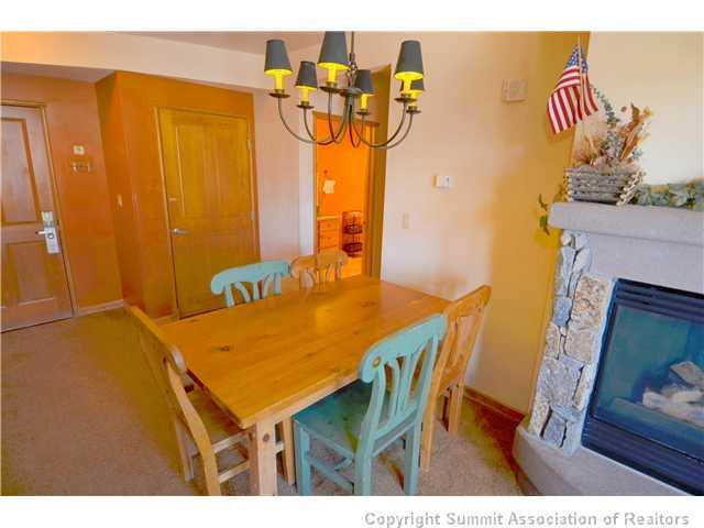 195 River Run Road, Unit 8037 Dillon, CO 80435 - Photo 11 of 25 a dining room with furniture and a wooden floor