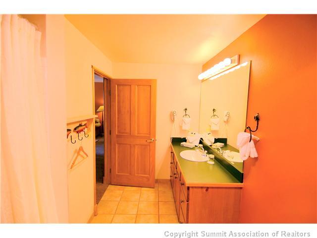 195 River Run Road, Unit 8037 Dillon, CO 80435 - Photo 14 of 25 a bathroom with a sink mirror and shower