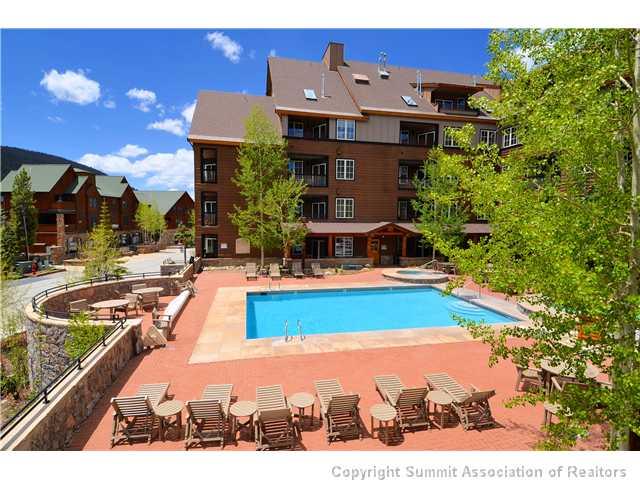 195 River Run Road, Unit 8037 Dillon, CO 80435 - Photo 18 of 25 a swimming pool with outdoor seating and yard