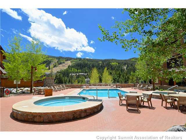 195 River Run Road, Unit 8037 Dillon, CO 80435 - Photo 19 of 25 a swimming pool with outdoor seating and yard