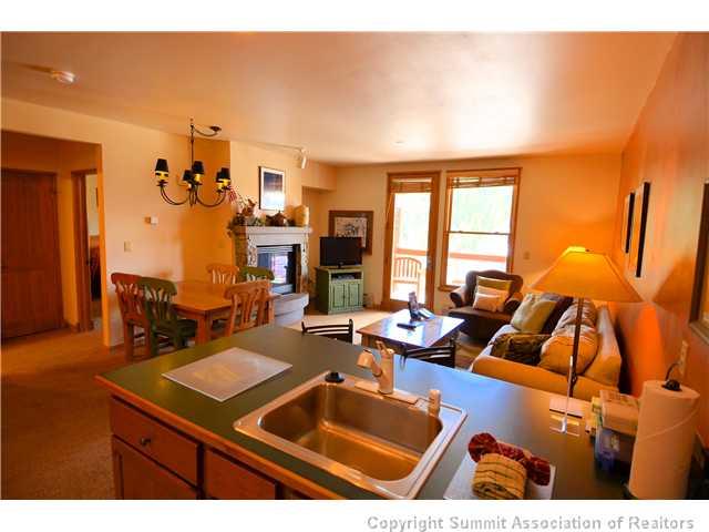 195 River Run Road, Unit 8037 Dillon, CO 80435 - Photo 3 of 25 a living room with furniture a rug and a floor to ceiling window