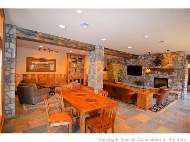 195 River Run Road, Unit 8037 Dillon, CO 80435 - Photo 21 of 25 a living room with furniture a flat screen tv and kitchen view