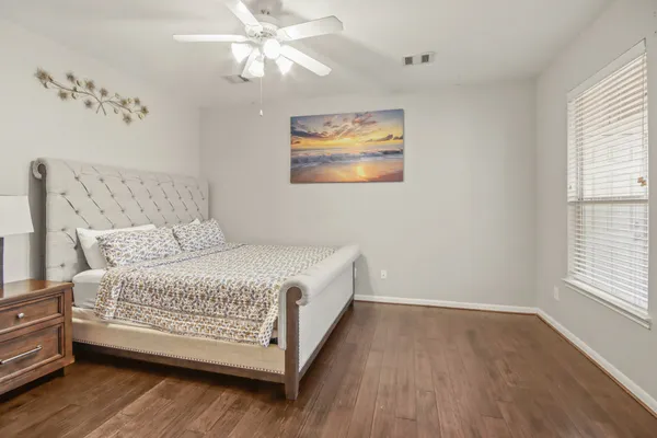 a room with a bed and a window