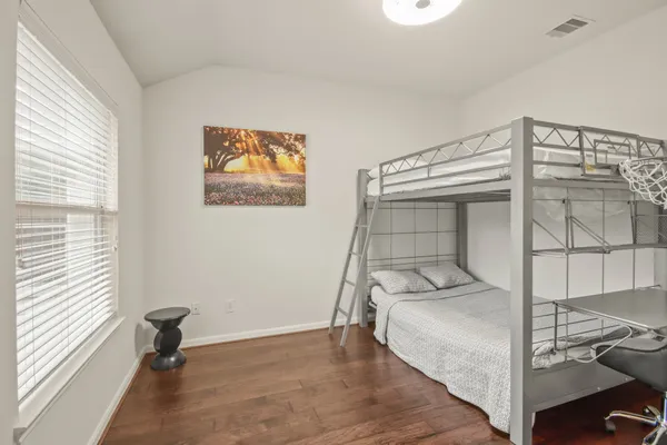 a room with gym equipment and a window