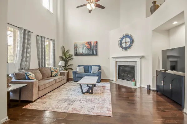 a living room with furniture and a fireplace