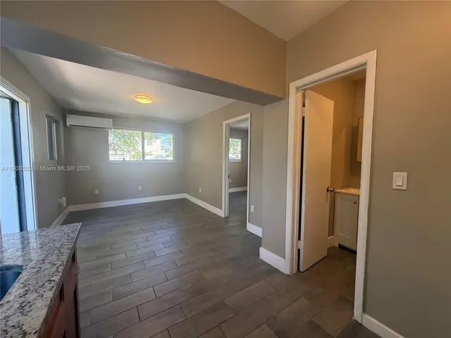 a view of livingroom with hardwood floor and window