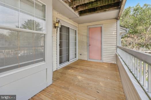 106 Lassen Court, Unit 5 Princeton, NJ 08540 - Photo 13 of 19 a view of an empty room with wooden floor and a window