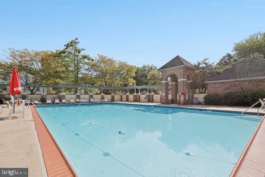106 Lassen Court, Unit 5 Princeton, NJ 08540 - Photo 15 of 19 a view of a swimming pool and a terrace