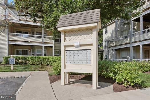 106 Lassen Court, Unit 5 Princeton, NJ 08540 - Photo 17 of 19 a front view of a house with garden