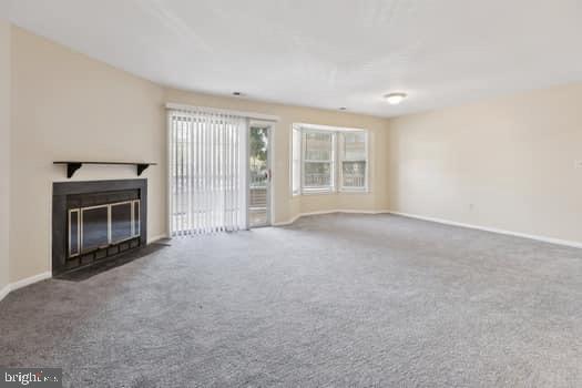 106 Lassen Court, Unit 5 Princeton, NJ 08540 - Photo 5 of 19 an empty room with windows