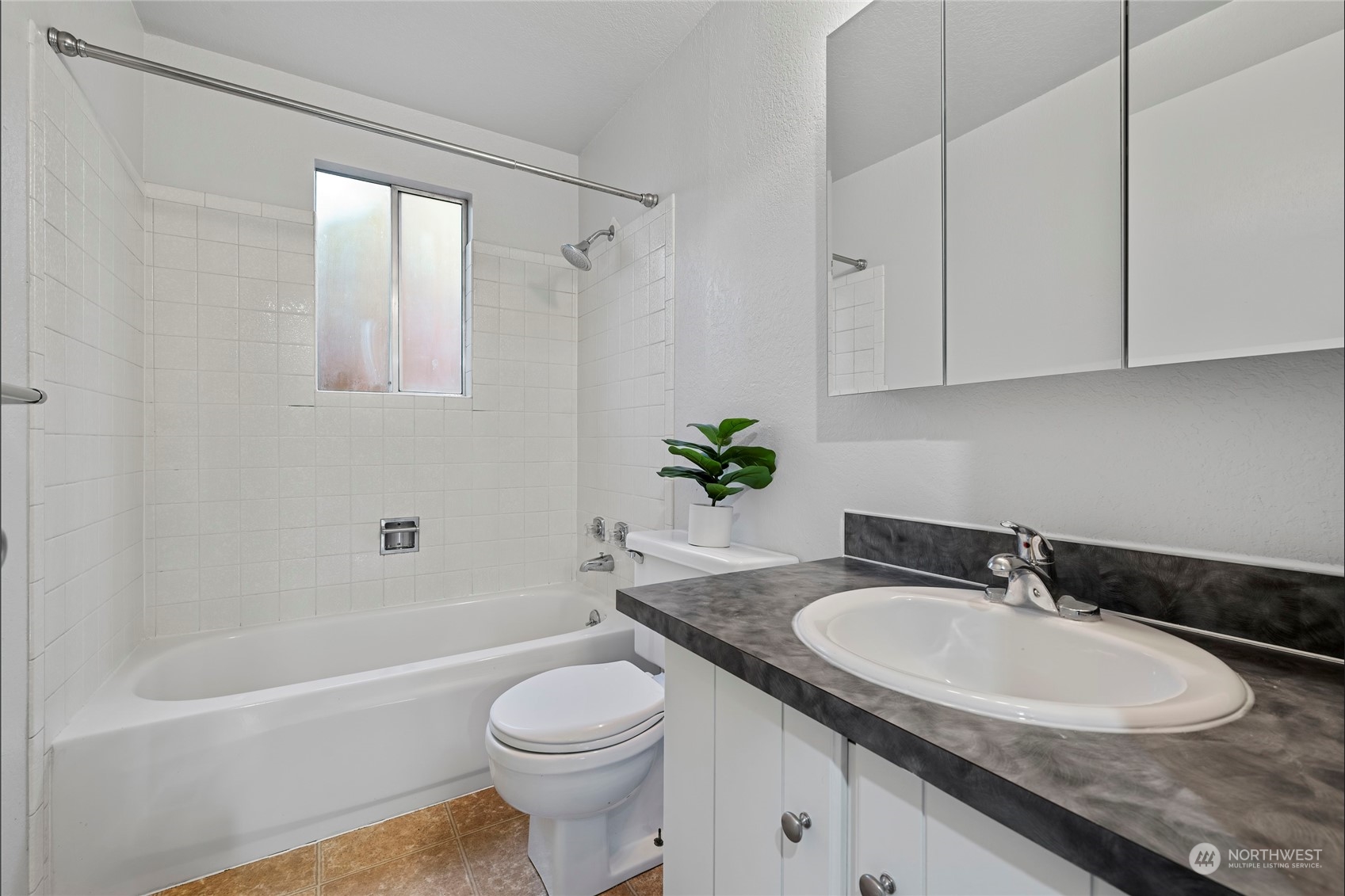 704 221st Street Southwest Bothell, WA 98021 - Photo 14 of 21 a bathroom with a granite countertop sink a toilet and bathtub