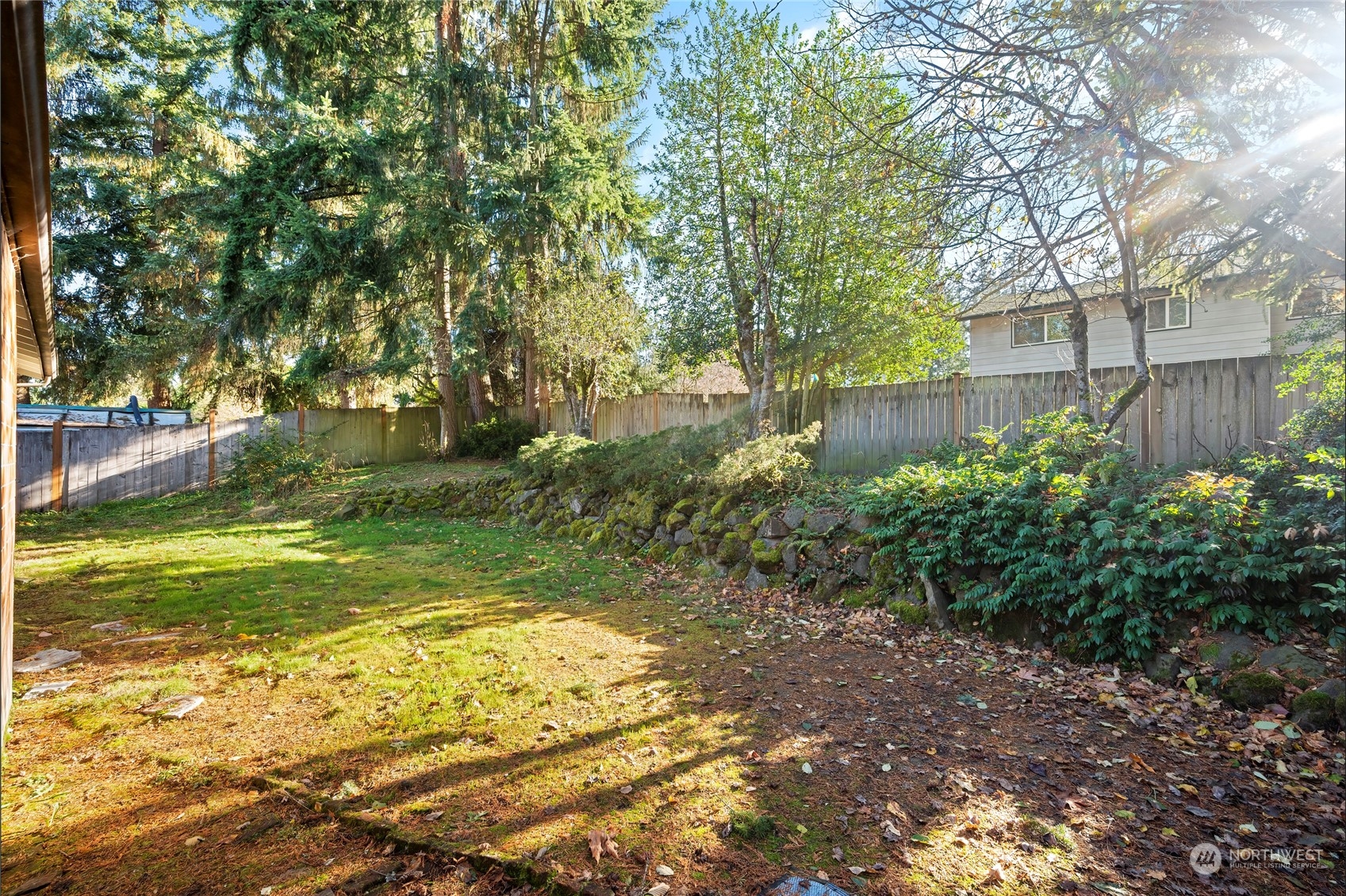 704 221st Street Southwest Bothell, WA 98021 - Photo 18 of 21 a view of a yard with large trees