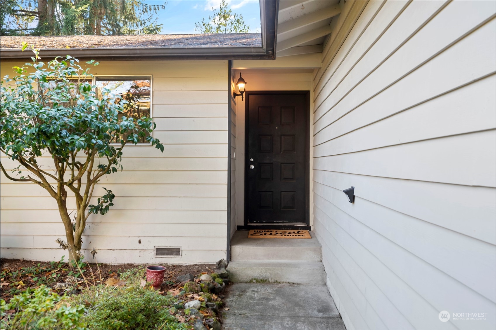 704 221st Street Southwest Bothell, WA 98021 - Photo 2 of 21 a view of house with a flower garden