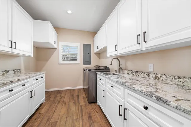 a bathroom with a sink vanity and mirror