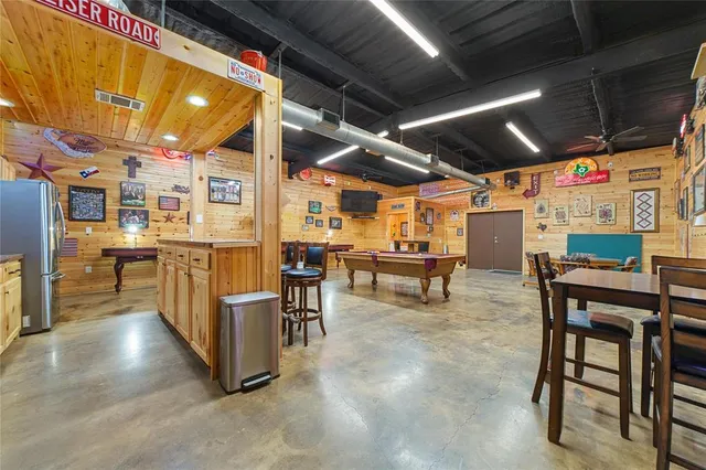 a kitchen with stainless steel appliances granite countertop a sink and cabinets