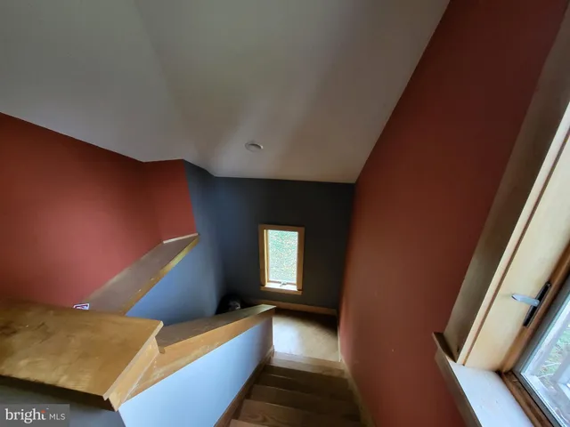 a bedroom with bed and window