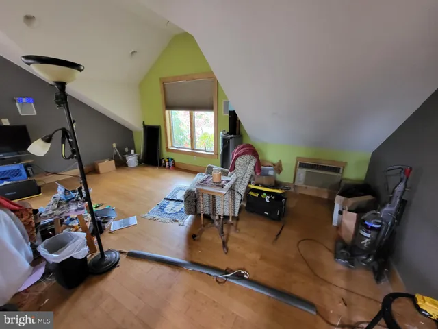 a room with gym equipment and a window