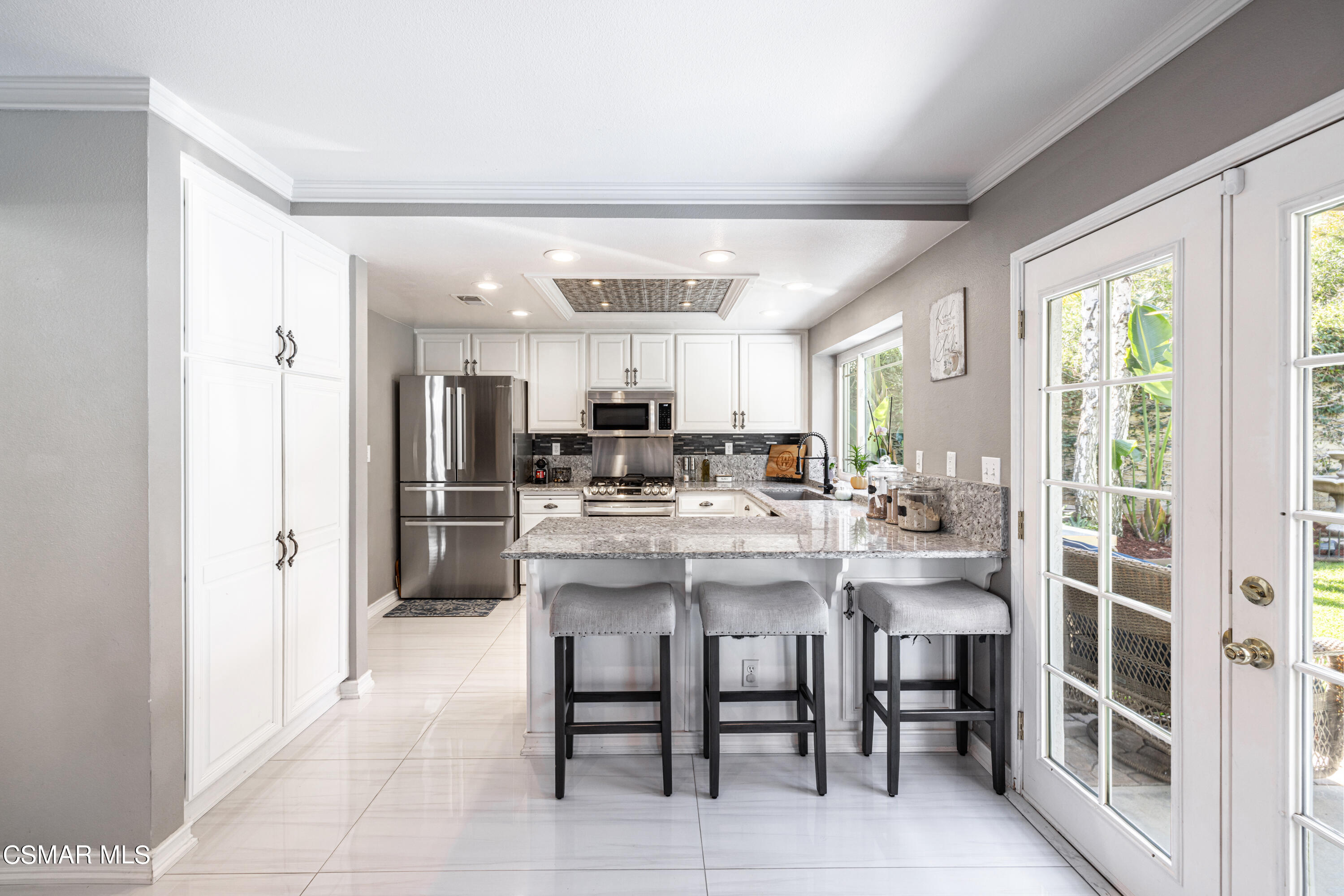 2087 Chenault Place Simi Valley, CA 93065 - Photo 14 of 36 a large kitchen with a table and chairs