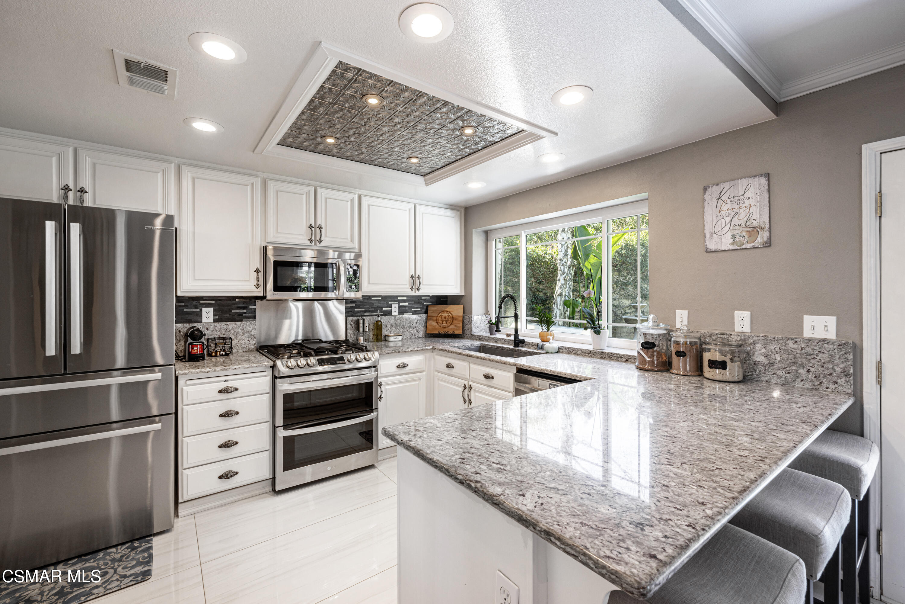 2087 Chenault Place Simi Valley, CA 93065 - Photo 15 of 36 a kitchen with stainless steel appliances granite countertop a stove refrigerator and sink