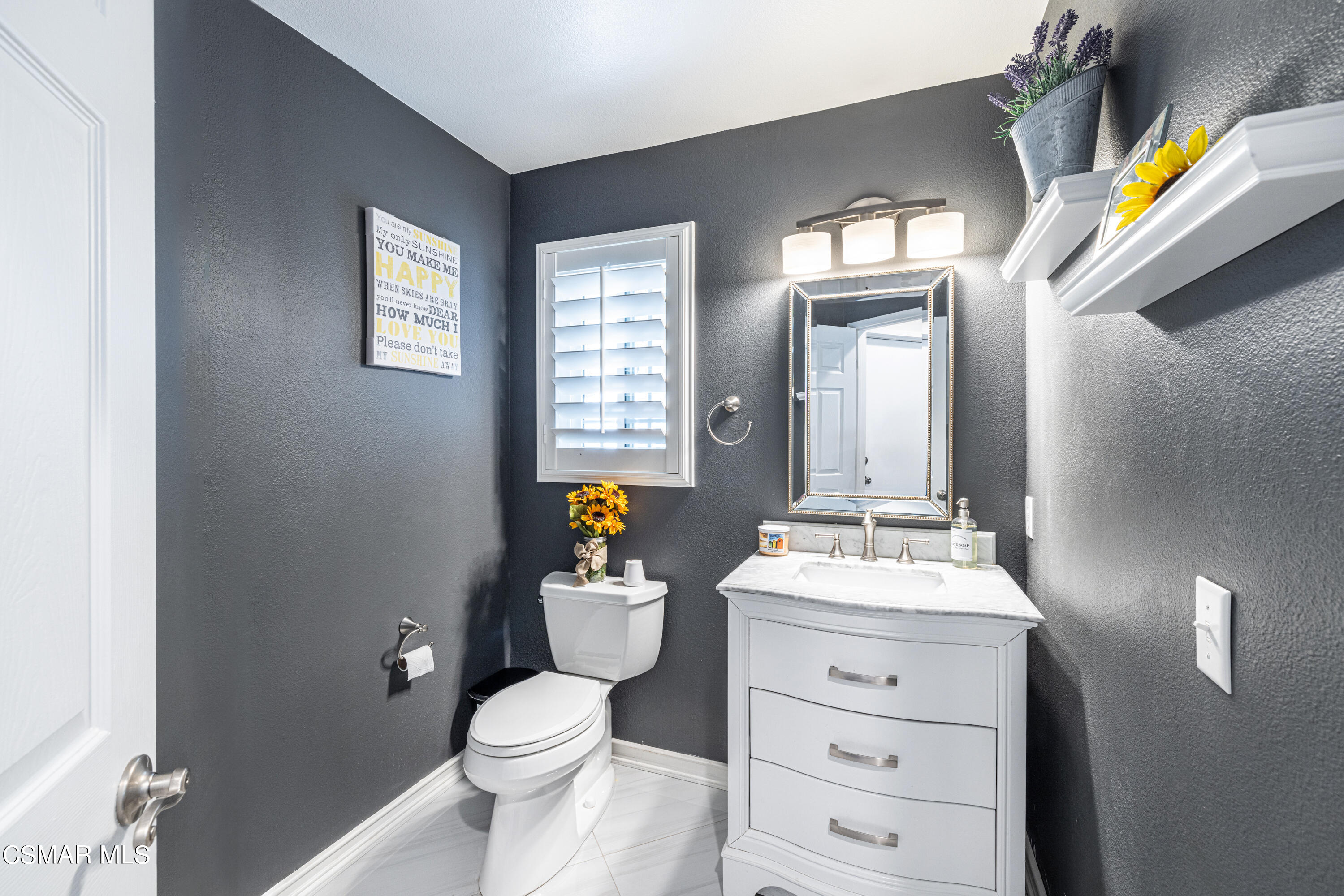 2087 Chenault Place Simi Valley, CA 93065 - Photo 17 of 36 a bathroom with a toilet a sink and a mirror
