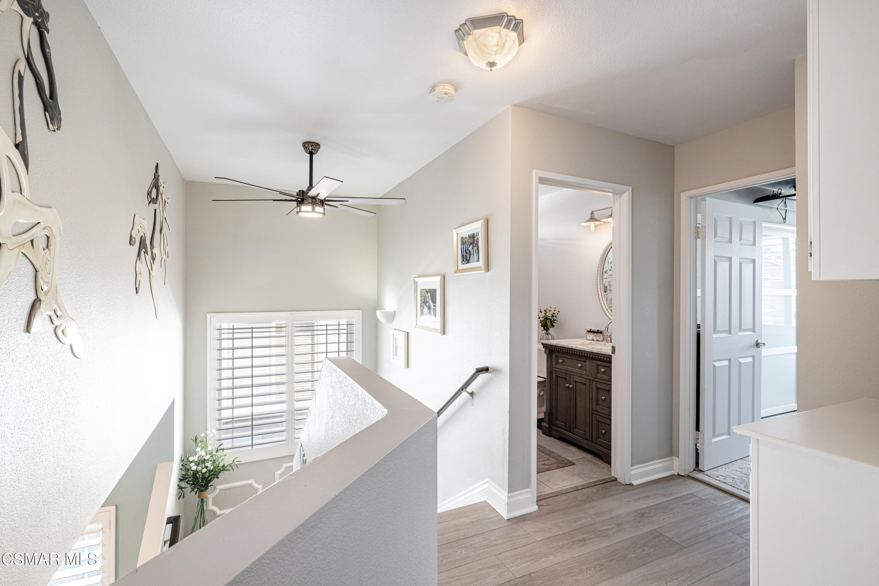 2087 Chenault Place Simi Valley, CA 93065 - Photo 19 of 36 a view of a kitchen with wooden floor and a kitchen
