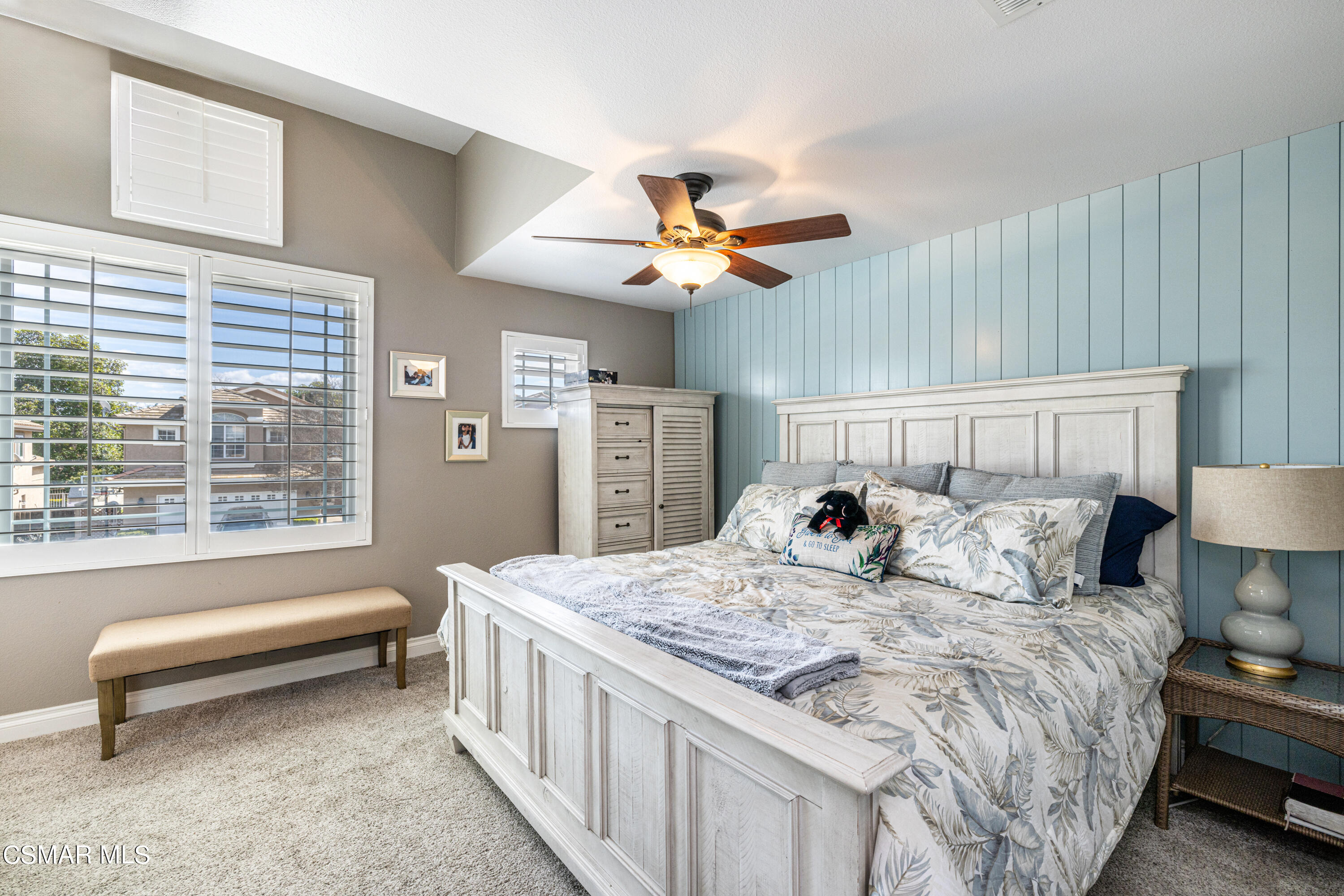 2087 Chenault Place Simi Valley, CA 93065 - Photo 21 of 36 a bedroom with a bed and a chandelier