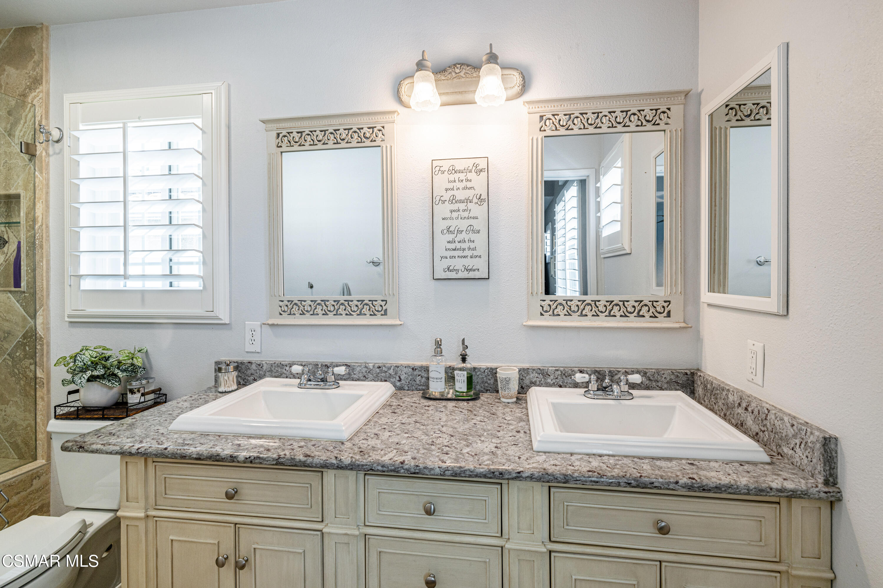2087 Chenault Place Simi Valley, CA 93065 - Photo 23 of 36 a bathroom with a granite countertop sink and a mirror