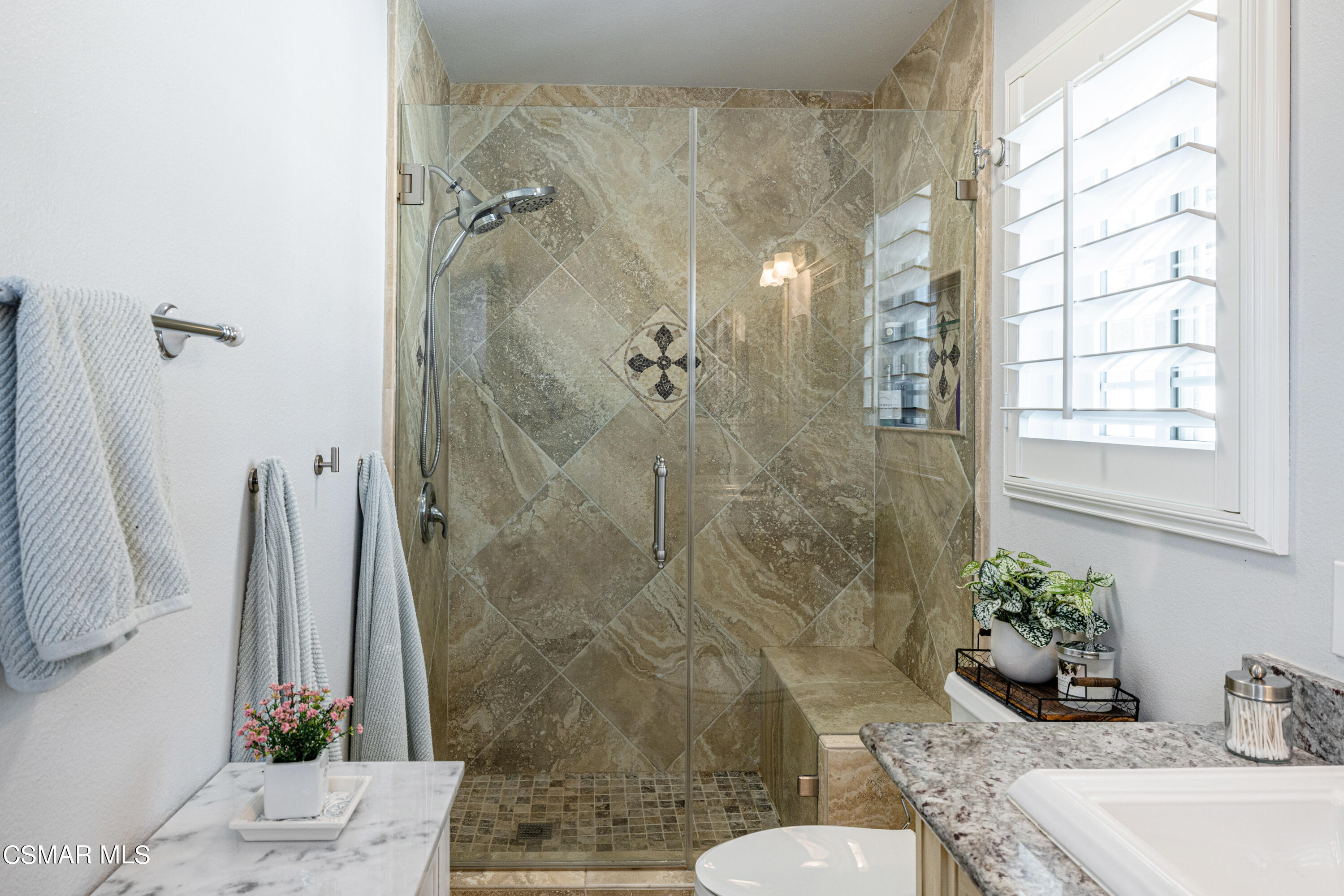 2087 Chenault Place Simi Valley, CA 93065 - Photo 24 of 36 a bathroom with a granite countertop sink a toilet and shower