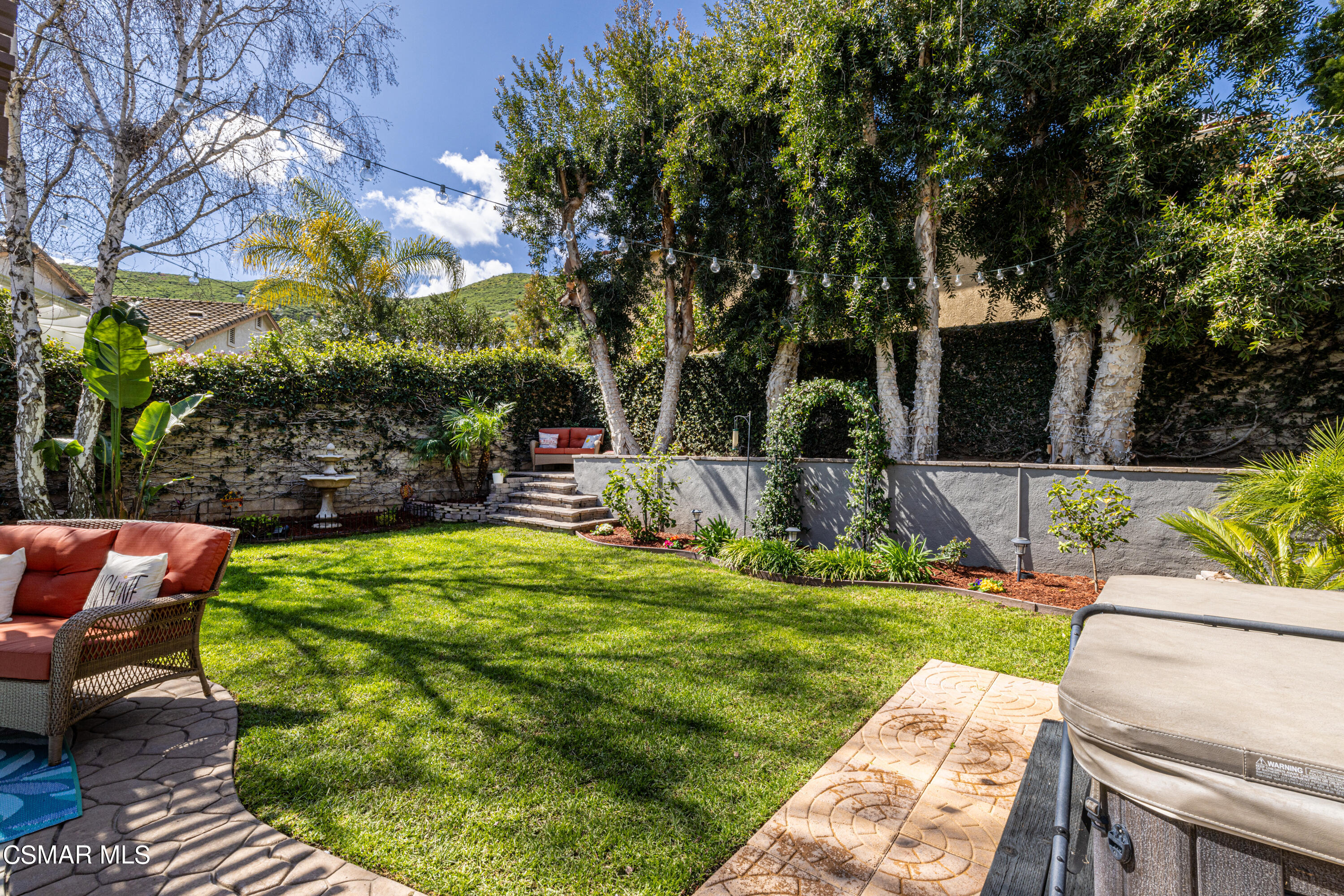 2087 Chenault Place Simi Valley, CA 93065 - Photo 30 of 36 a view of a backyard with sitting area