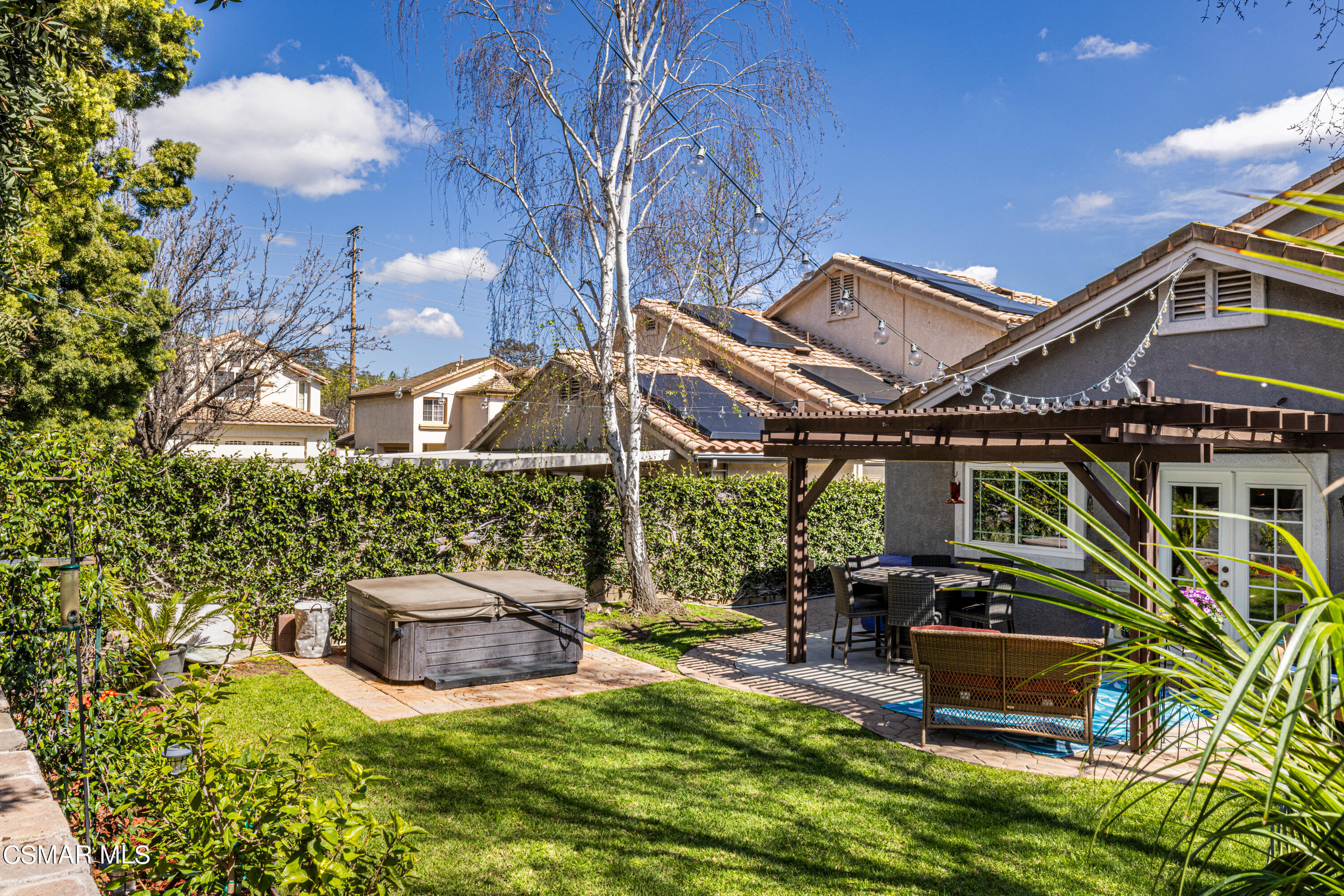 2087 Chenault Place Simi Valley, CA 93065 - Photo 34 of 36 a backyard of a house with table and chairs