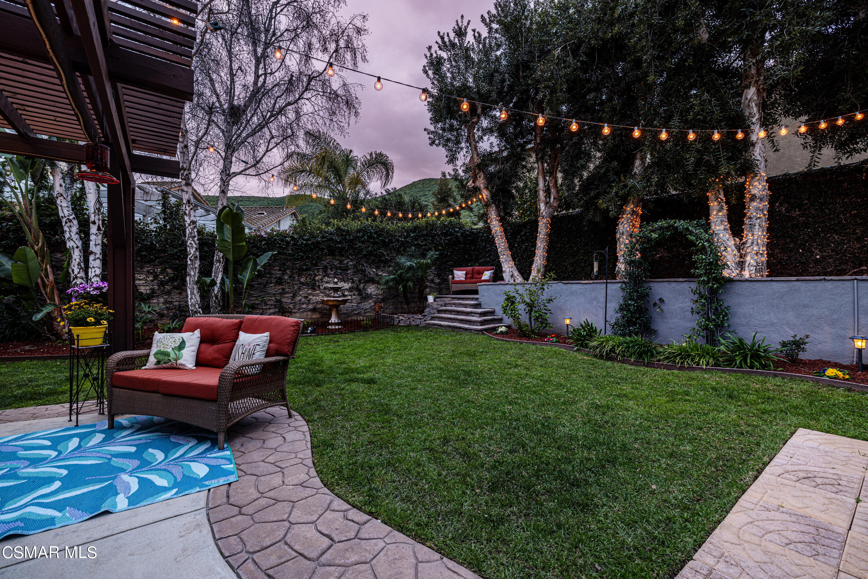 2087 Chenault Place Simi Valley, CA 93065 - Photo 35 of 36 a view of a yard with furniture and a fire pit