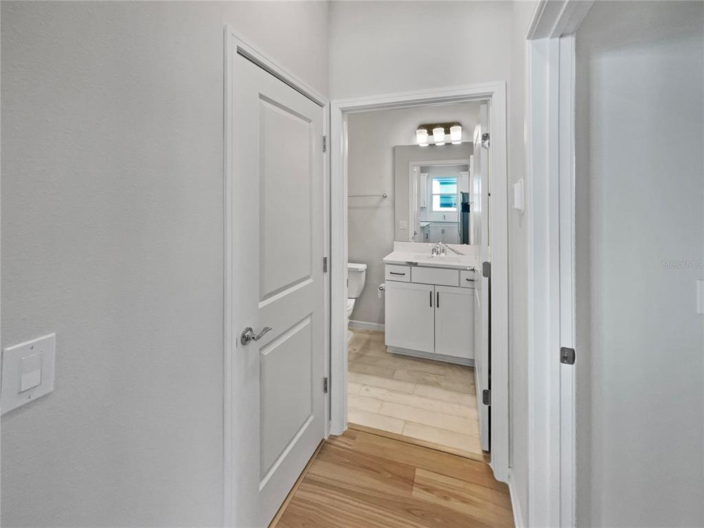 1909 Spring Shower Circle Kissimmee, FL 34744 - Photo 16 of 32 a bathroom with white cabinets