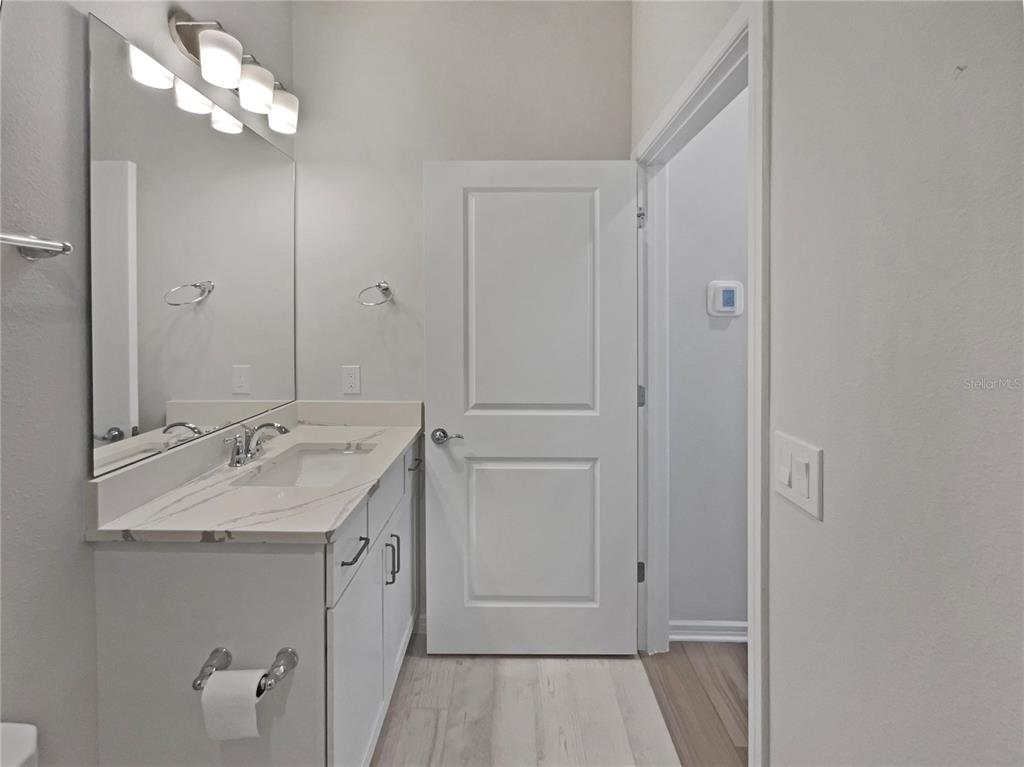 1909 Spring Shower Circle Kissimmee, FL 34744 - Photo 18 of 32 a bathroom with a sink vanity granite and shower