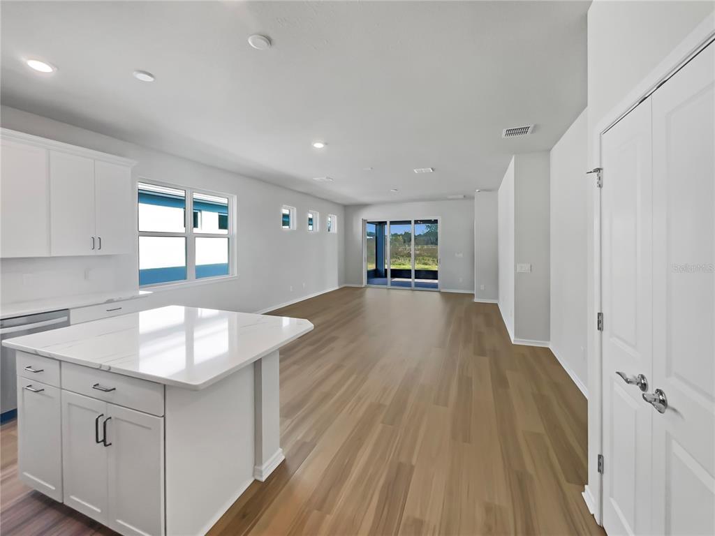 1909 Spring Shower Circle Kissimmee, FL 34744 - Photo 20 of 32 a kitchen with granite countertop a sink window and cabinets