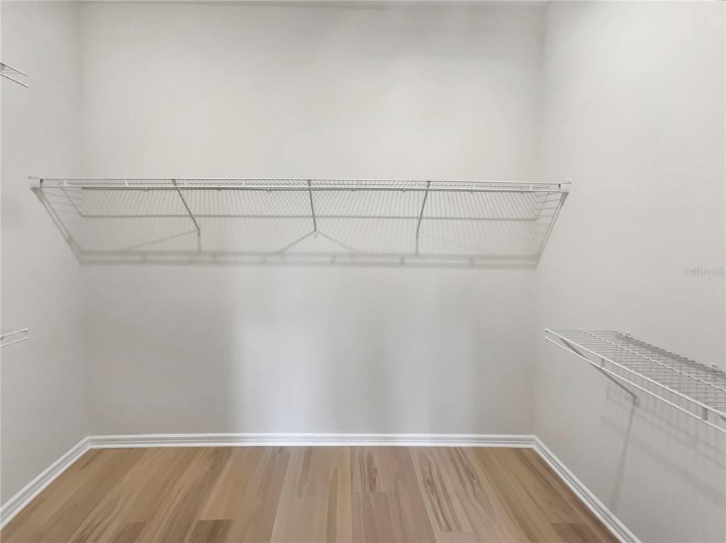 1909 Spring Shower Circle Kissimmee, FL 34744 - Photo 28 of 32 a view of a room with racks on the wall