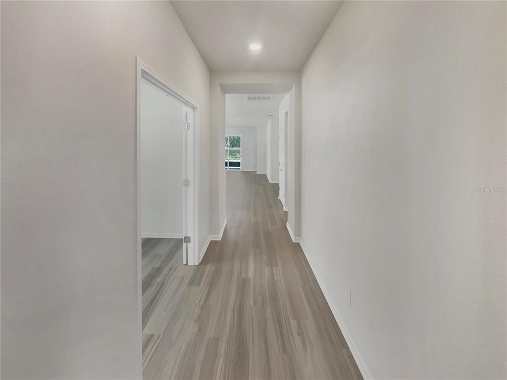 1909 Spring Shower Circle Kissimmee, FL 34744 - Photo 10 of 32 a view of a hallway with wooden floor
