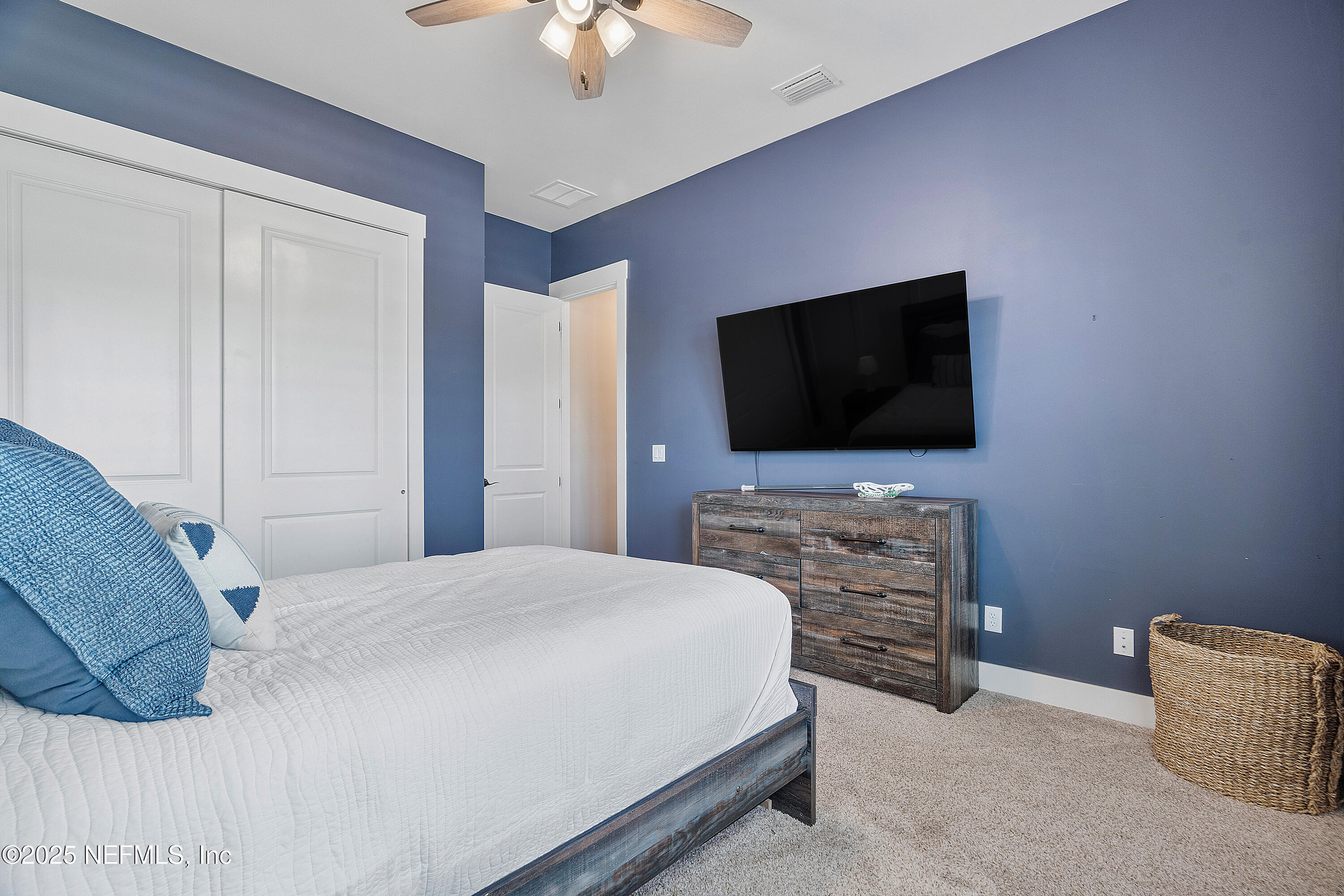 295 Seahill Drive St. Augustine, FL 32092 - Photo 12 of 101 a bedroom with a bed and a flat screen tv