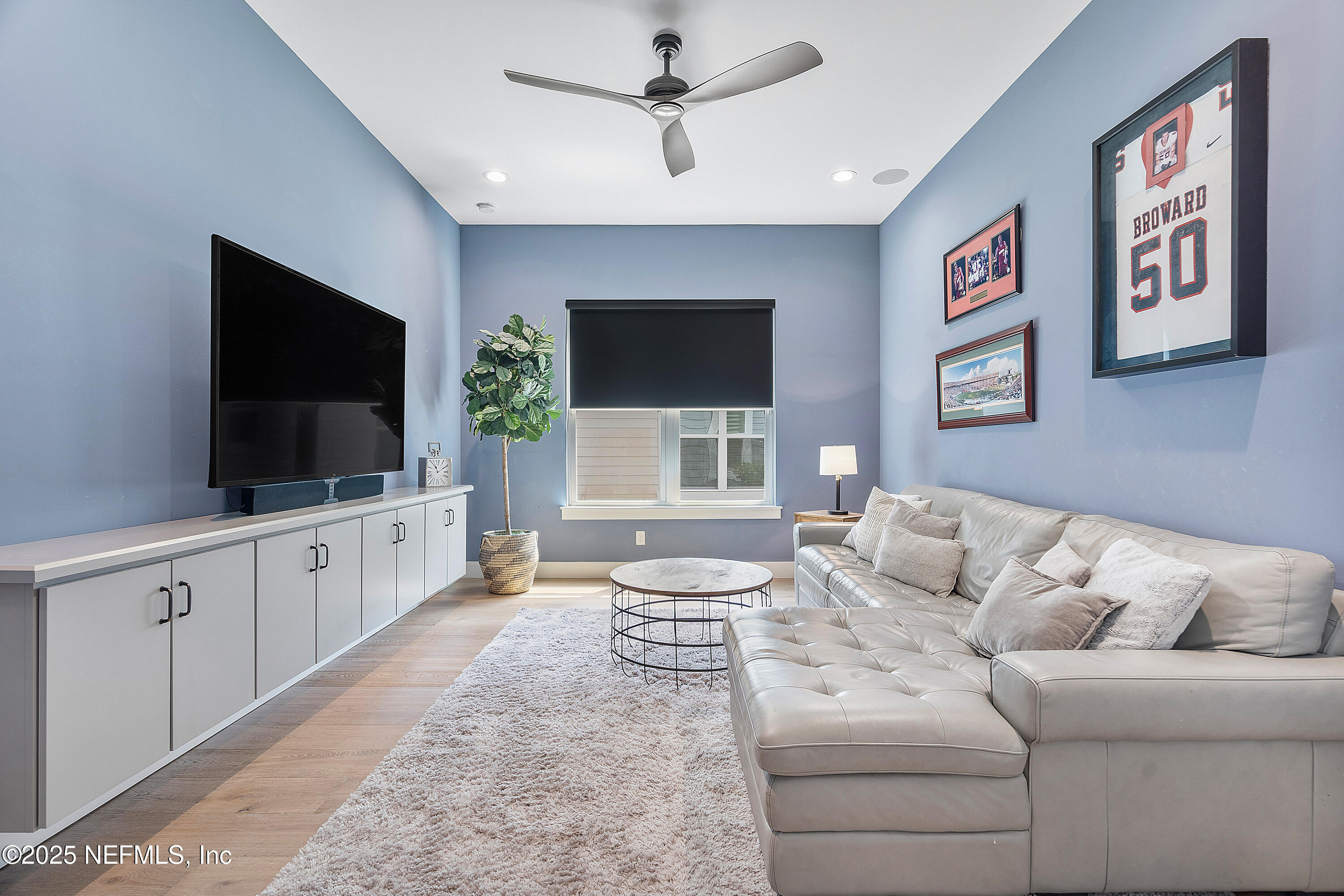 295 Seahill Drive St. Augustine, FL 32092 - Photo 15 of 101 a living room with furniture and a flat screen tv